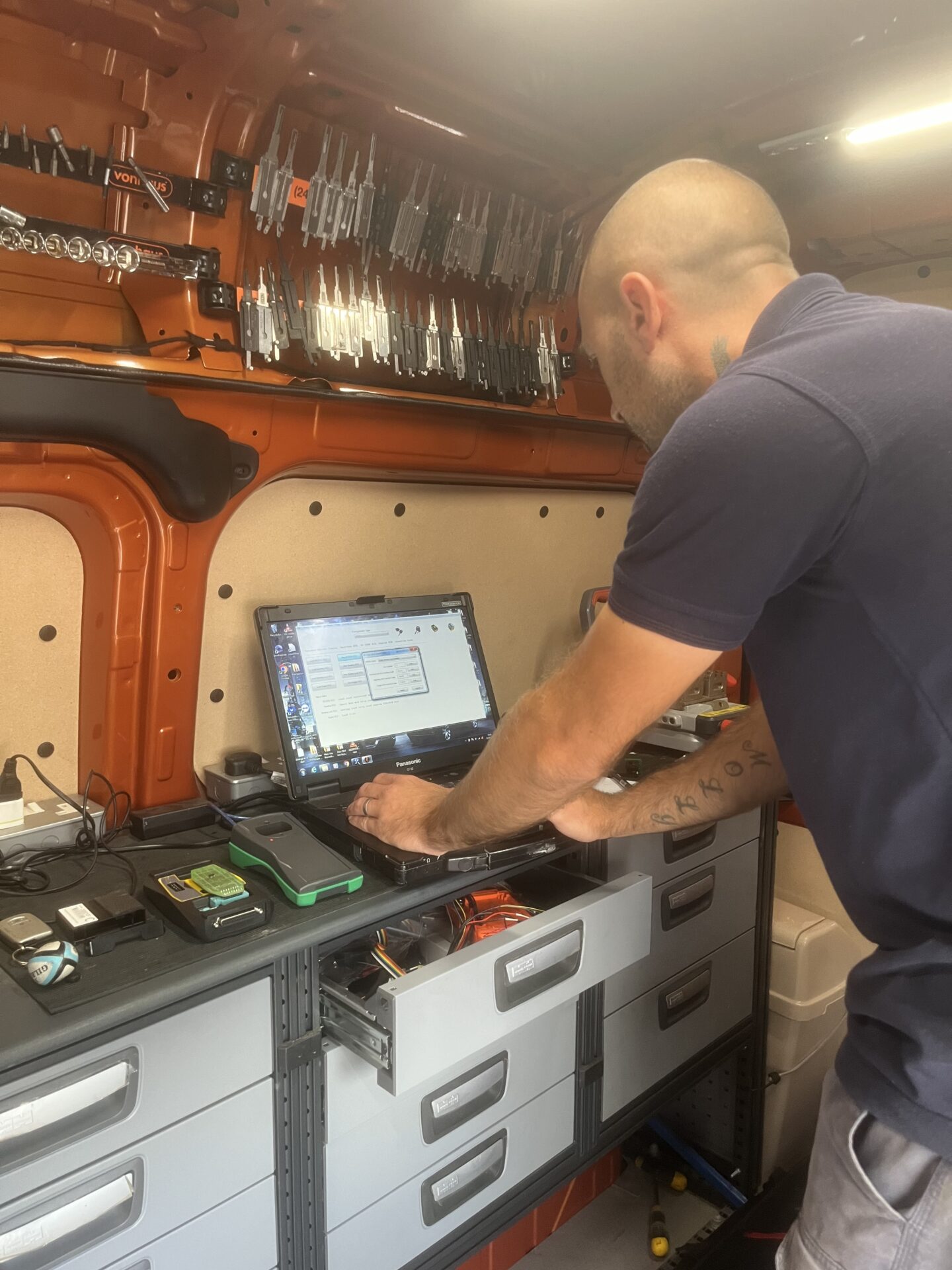 auto locksmith using a computer inside their van